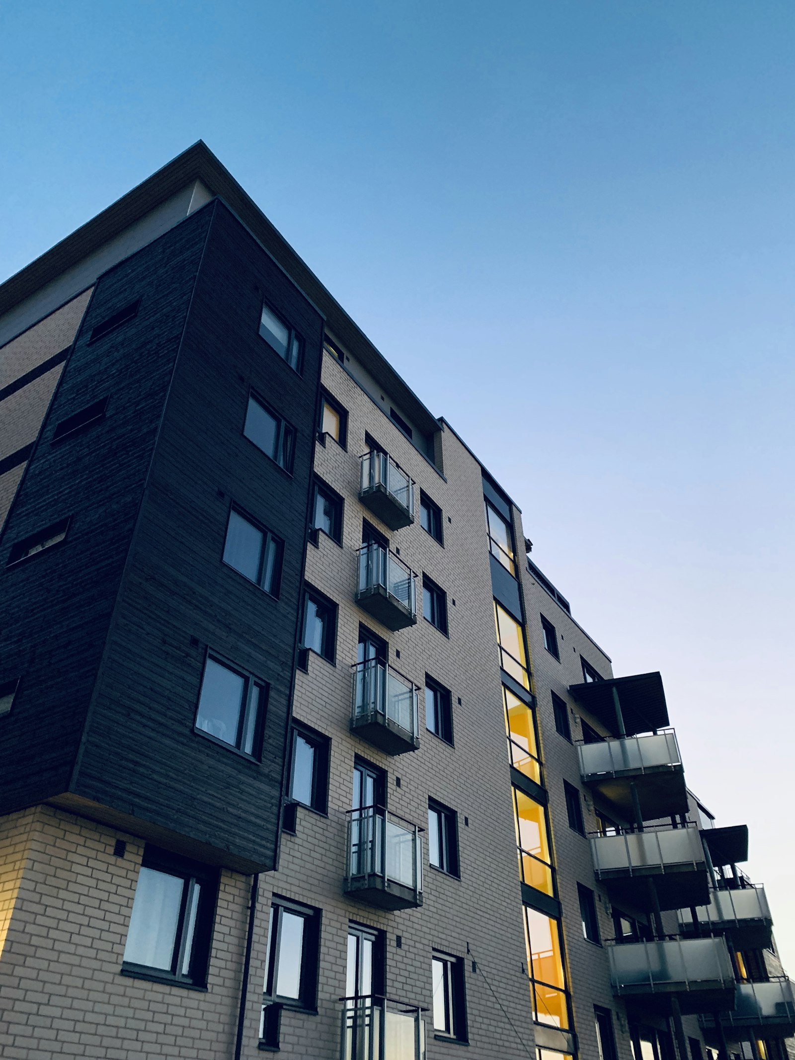 Modern apartment building exterior representing property management services